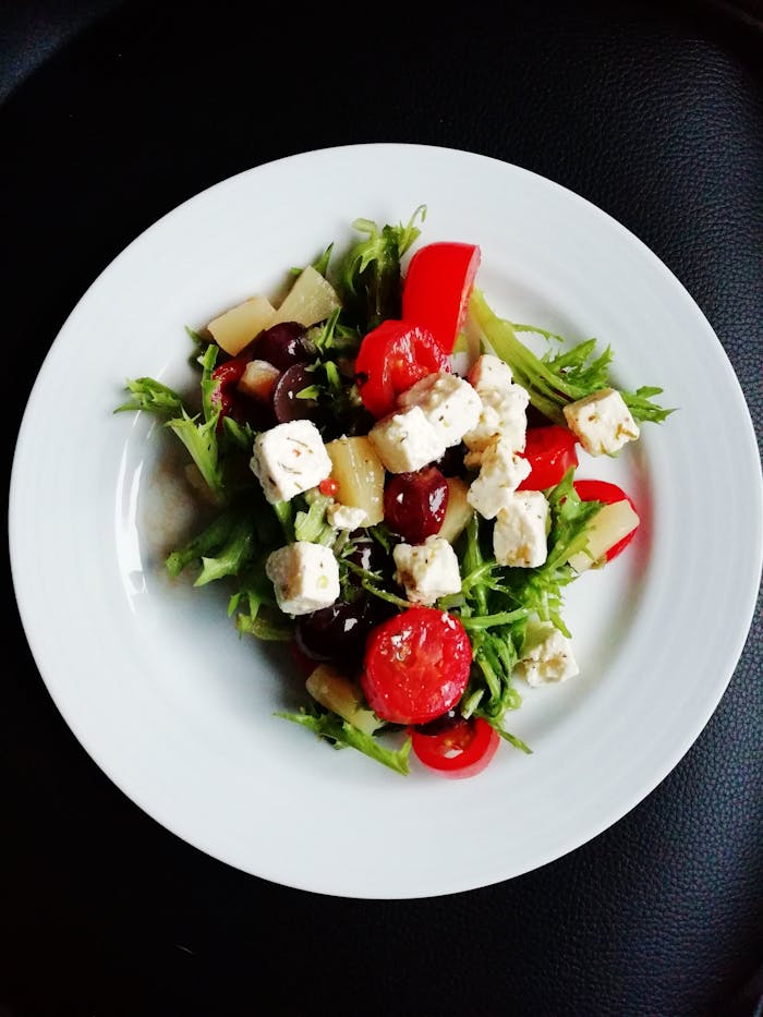 contact-header Delicious Greek salad featuring fresh vegetables and creamy feta cheese, perfect for a healthy meal.
